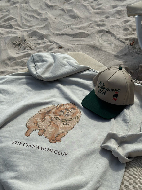 Brands signature hoodie featuring the iconic Pomeranian and cinnamon club logo.  