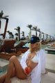 Seaside Chic: Black Hat with Blue and White Embroidery, Featuring 'Sea Salt' Side Detail - Shop Cinnamon Club